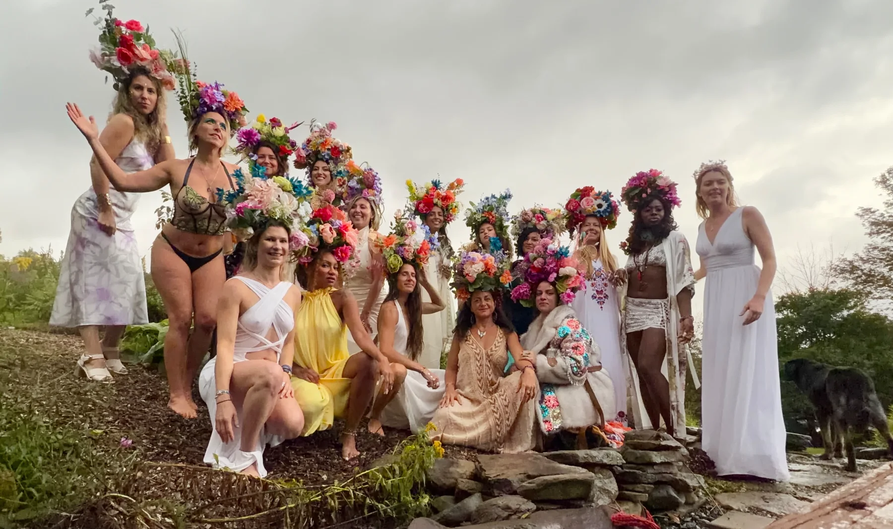 The Goddess Gathering 2026 circle in their flower crowns