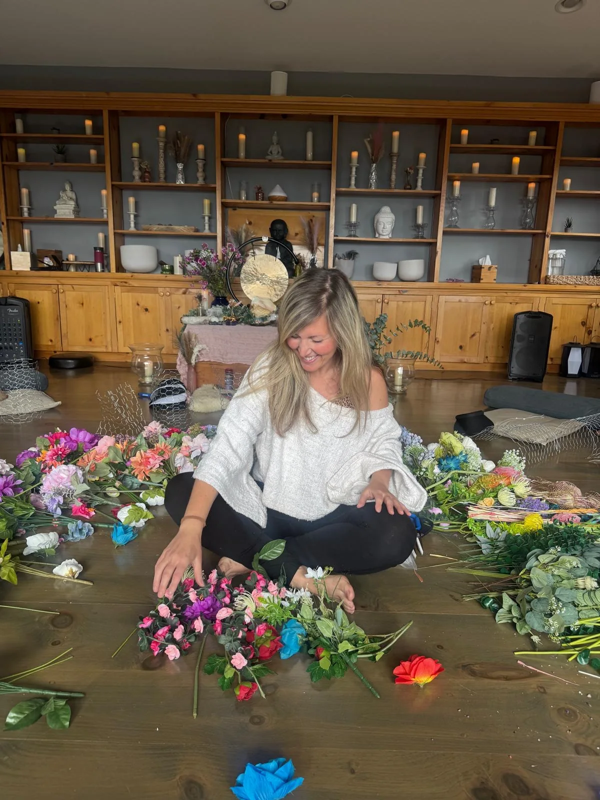 Making flower crowns on the studio floor